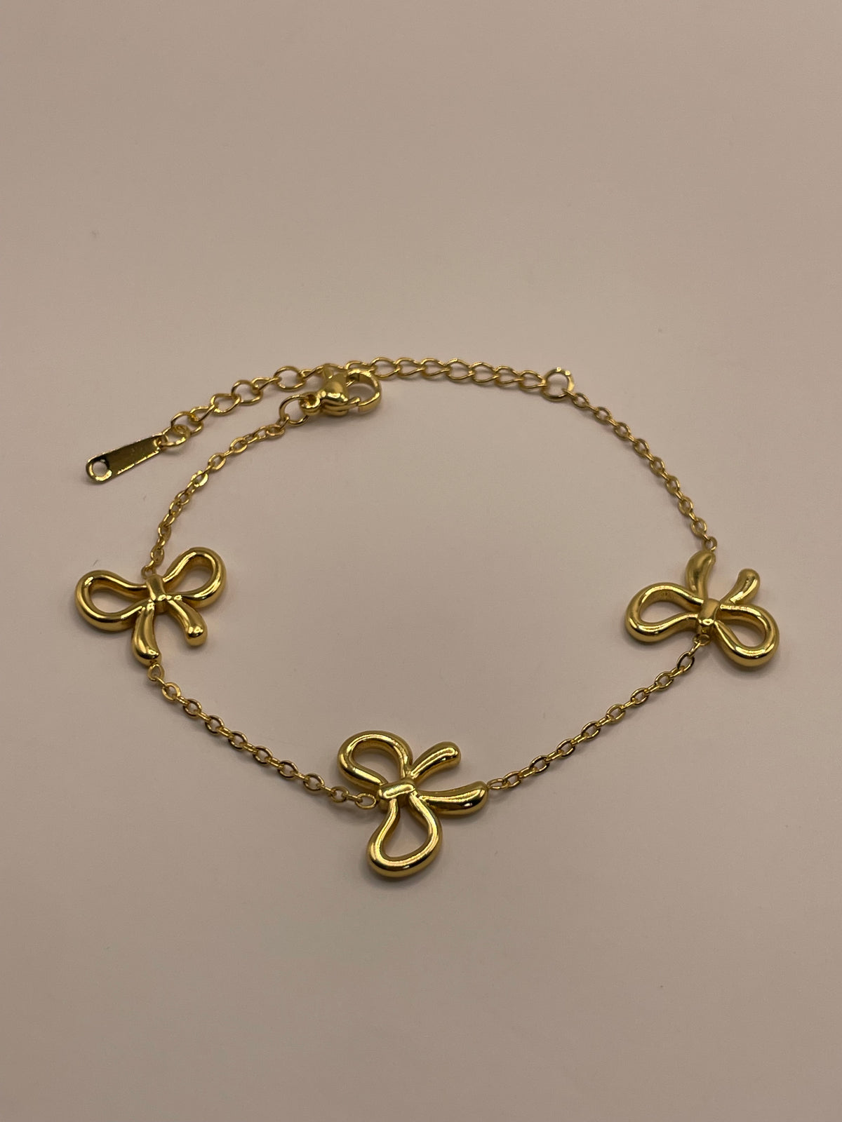 PULSERA MOÑOS DORADA