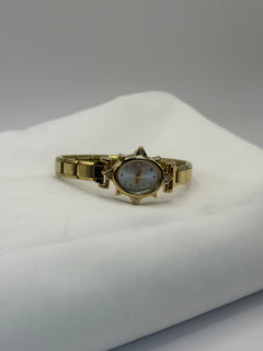 RELOJ ESTRELLA DORADO