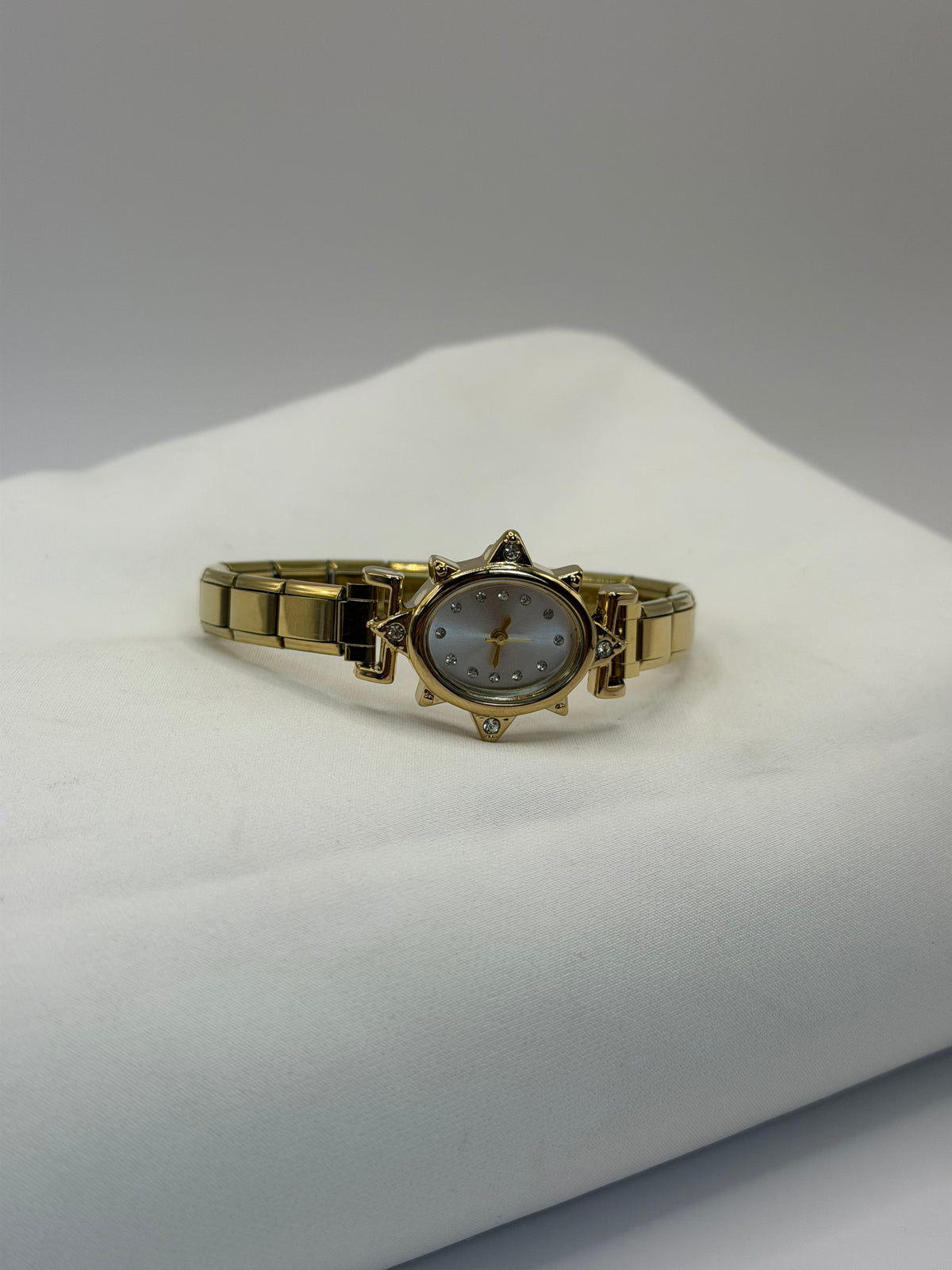 RELOJ ESTRELLA DORADO