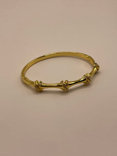 PULSERA X DORADA