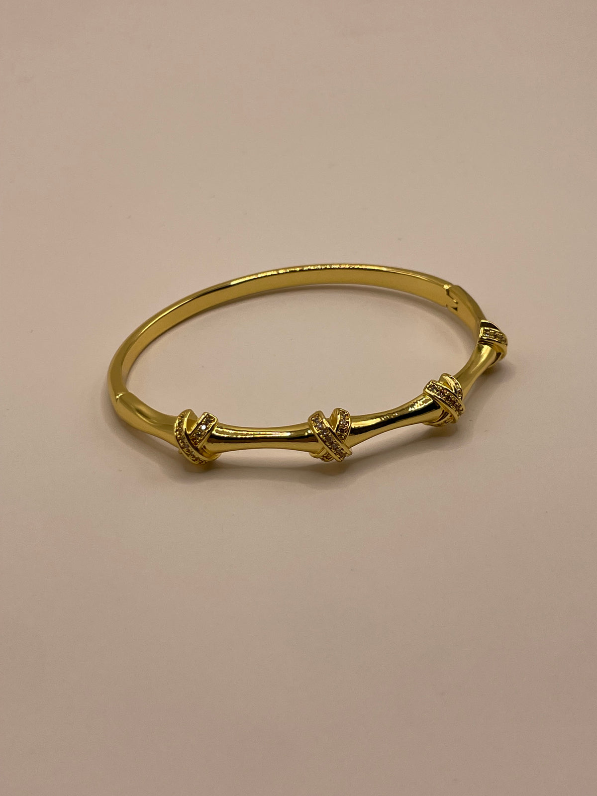 PULSERA X DORADA