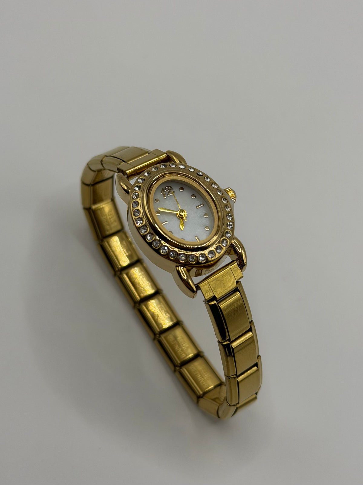 RELOJ ITALIANO DORADO OVALADO GLOW