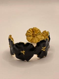 PULSERA FLOR NEGRA DORADA