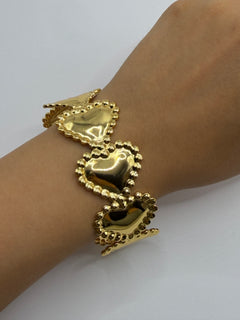 PULSERA CORAZONES DORADA