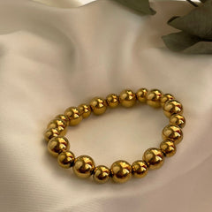 PULSERA CUENCAS DORADA